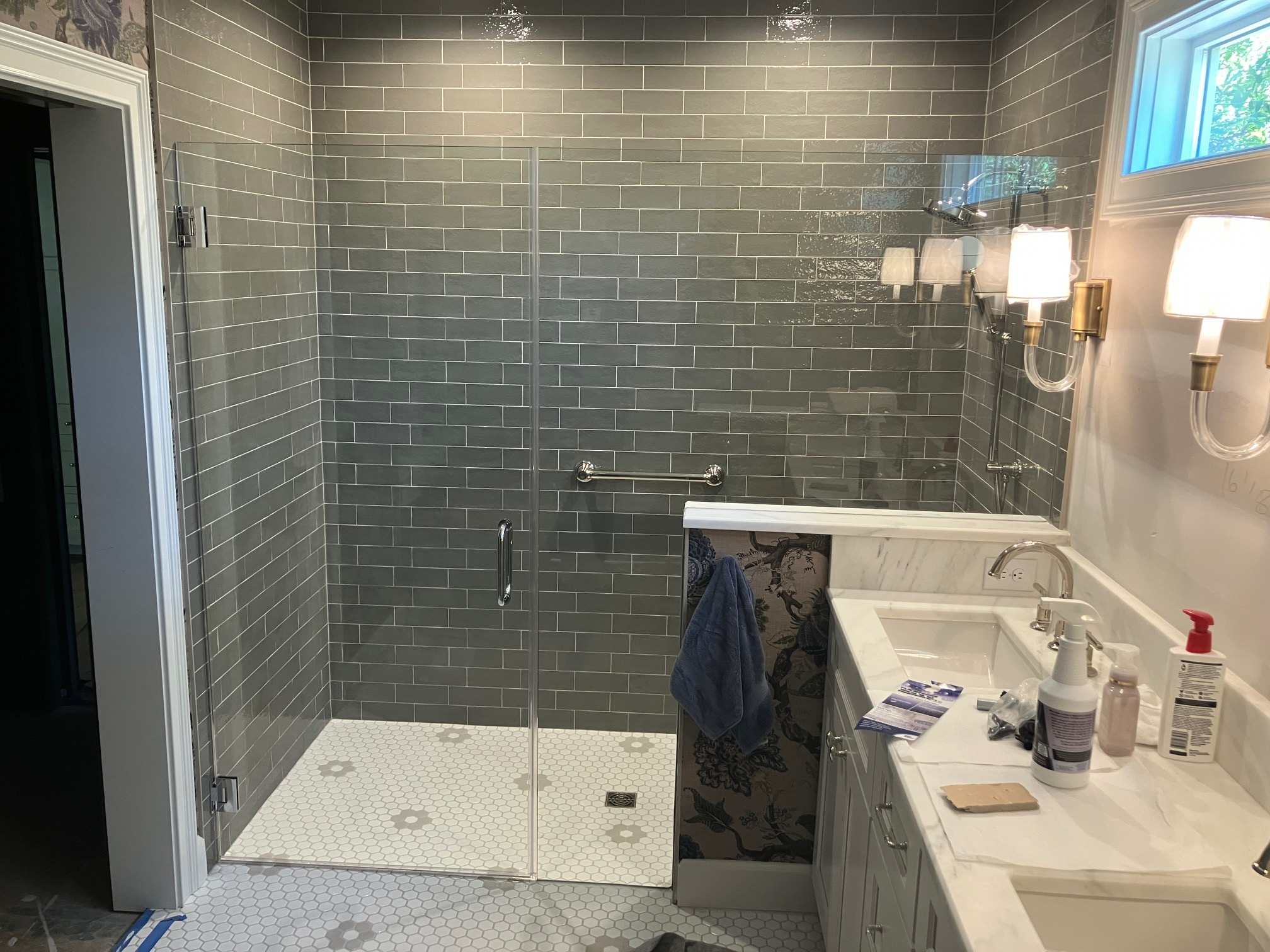 Tile cut-in frameless walk-in shower with zero threshold flush entry